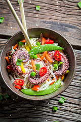 Octopus with vegetables and noodles