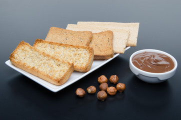 Composition of chocolate hazelnut spread, hazelnuts and differen