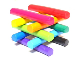 Colorful kid's plasticine on white background