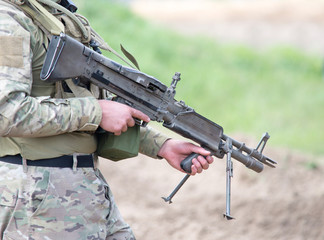 Fototapeta premium soldier with heavy machine gun