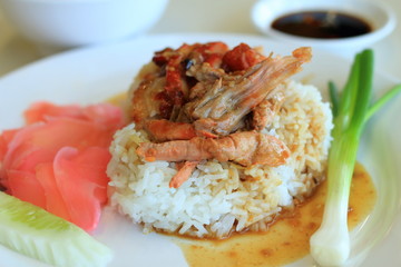 roast duck over rice with sauce and soup
