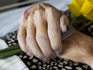 Closeup of a dead womans folded hands
