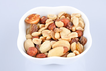 Fototapeta na wymiar Mixed nuts in a white bowl