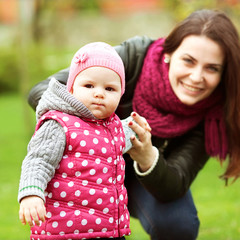 Mother and baby in park portrait