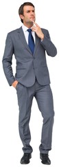 Thinking businessman touching his chin