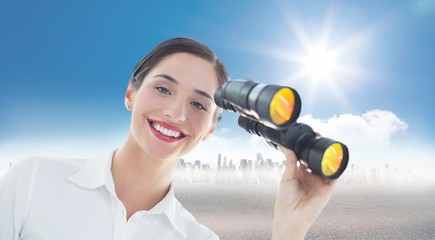 Composite image of smiling business woman with binoculars