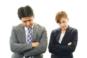 苦悩するビジネスマンとOL