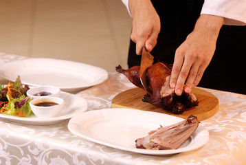 cooking roast duck in restaurant