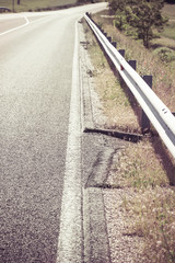 grain gutter in the road, next to pavement - colorized photo