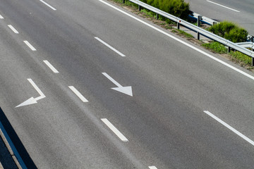 arrows on asphalt showing traffic where to go