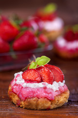Homemade cake with strawberries on a rustic table