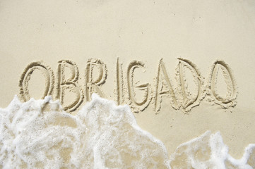 Obrigado Thank You Message in Sand