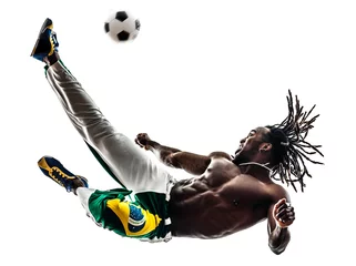 Küchenrückwand glas motiv Brazilian  black man soccer player kicking football silhouette © snaptitude