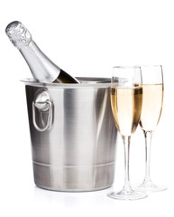 Champagne bottle in bucket and two glasses