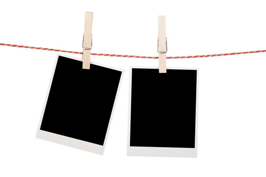 Blank photos hanging on clothesline