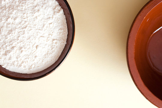 flour in a brown ceramic bowl