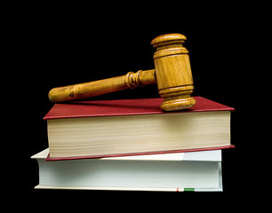 books and gavel isolated on a black background