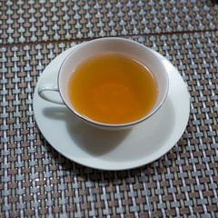 Cup of black tea on the table ready to drink.