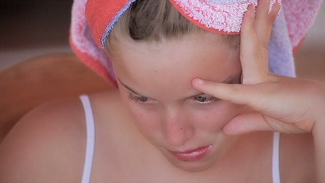 Sad child girl crying after a reprimanded