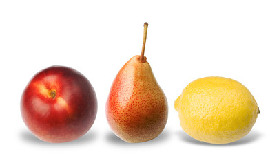 Three fruits (lemon, pear, peach) isolated on white background.