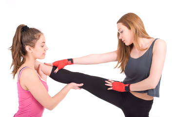 Two young women practicing in studio