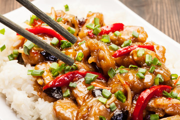Sirloins on sweet and sour sauce served with rice © Sławomir Fajer