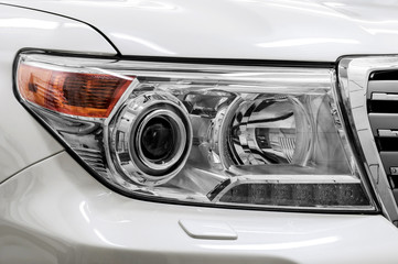 Closeup headlights of car.