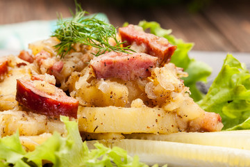 Scalloped potatoes with sausage and bacon