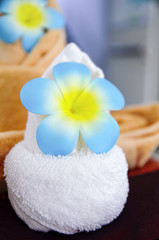 Obraz na płótnie Canvas Plumeria with towel for tropical spa concept