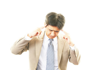 頭痛を訴えるビジネスマン