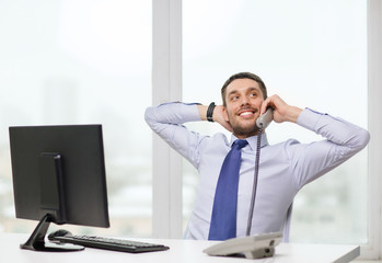 smiling businessman or student with computer