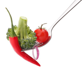 Fresh raw vegetables on fork isolated on white background cutout
