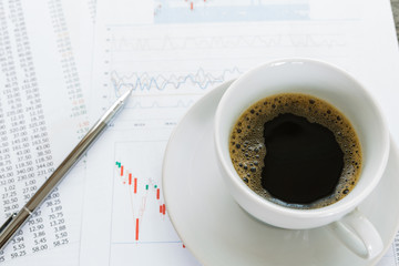 Coffice cup  and financial documents