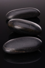 Spa stone arrangement on black surface