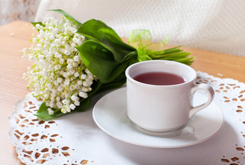 morning tea table setting with Lily of the valley flowers bouqet