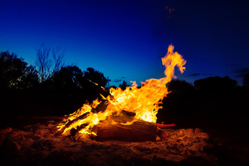 Big bonfire against night sky in Australian outback