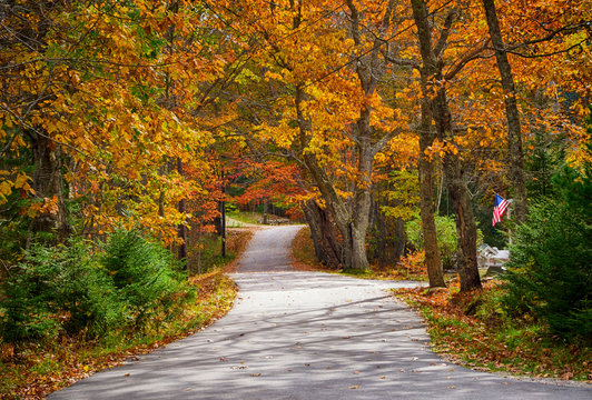 Winding autumn country road in New England