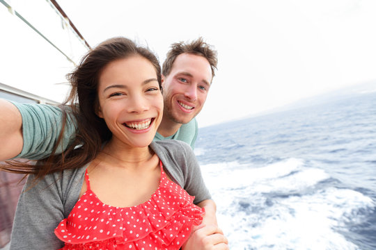 Cruise ship couple taking selfie photo
