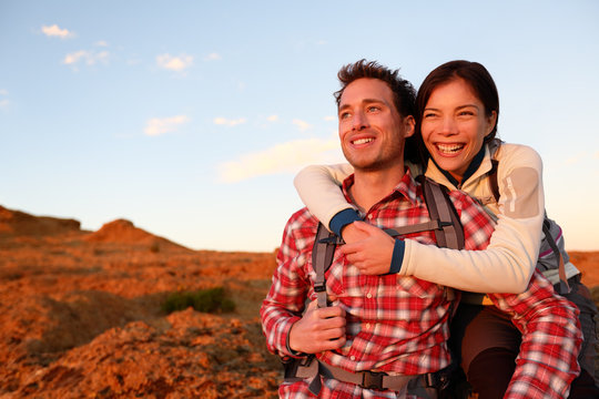 Happy couple active lifestyle hiking outdoors