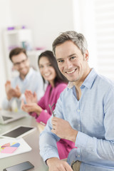 Fototapeta premium businessman congratulated by colleagues