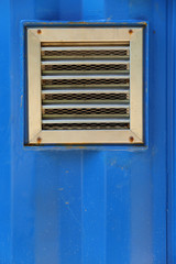 aluminum ventilation on blue cargo container wall