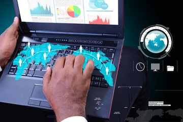 Business man showing financial report in laptop