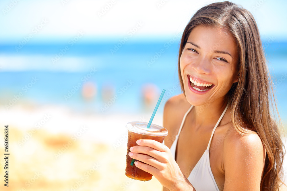 Wall mural beach woman drinking cold drink beverage