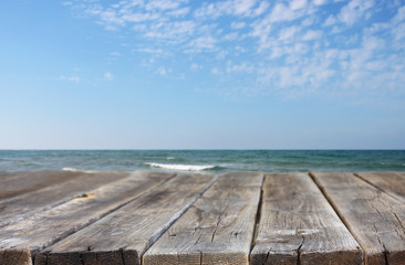 wood deck in front of beach landscape