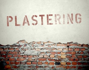 Plastering concept on old brick wall
