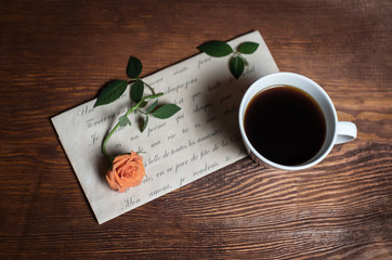 Romantic love letter, coffee and rose. Vintage retro background.