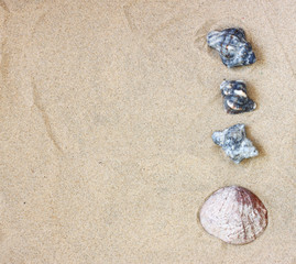 Fototapeta na wymiar top view of collection of beach stones rock and shells over sand