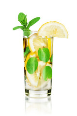 Iced tea with lemon and mint on white background