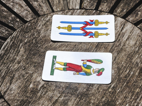 Two cards on a wooden table
