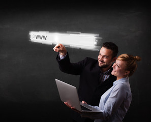 Young business couple touching web browser address bar with www